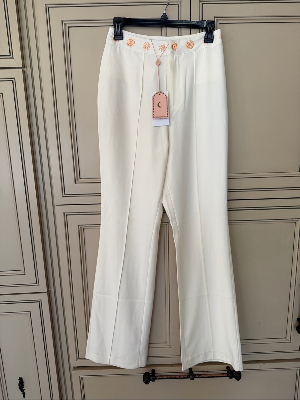 The wolf gang Cream Boot Cut Pants with Embroidered Waist Detail